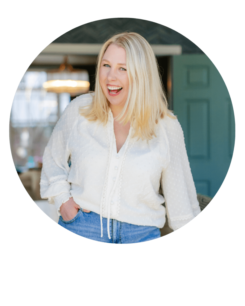 Photo of Salisbury Wiltshire based wedding photographer Lydia Stamps smiling at the camera wearing a white top and jeans